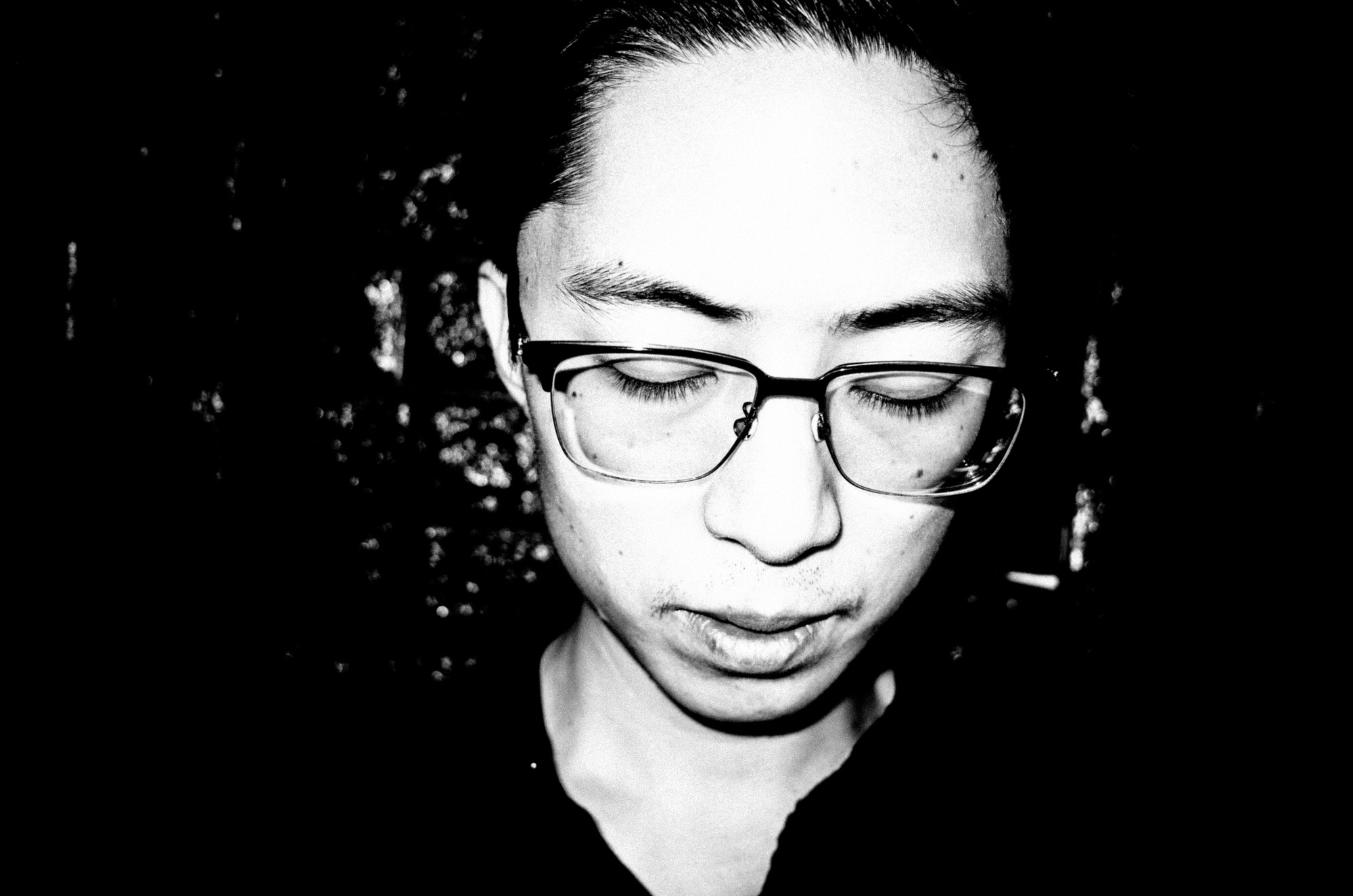 eric kim photography black and white hanoi-0009770-self portrait - looking down.jpg