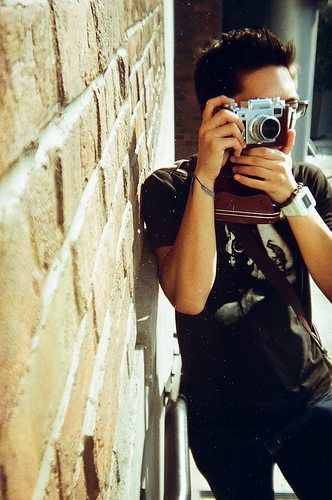 Me shooting in the streets with my Contax IIIa. Shot by John Golden