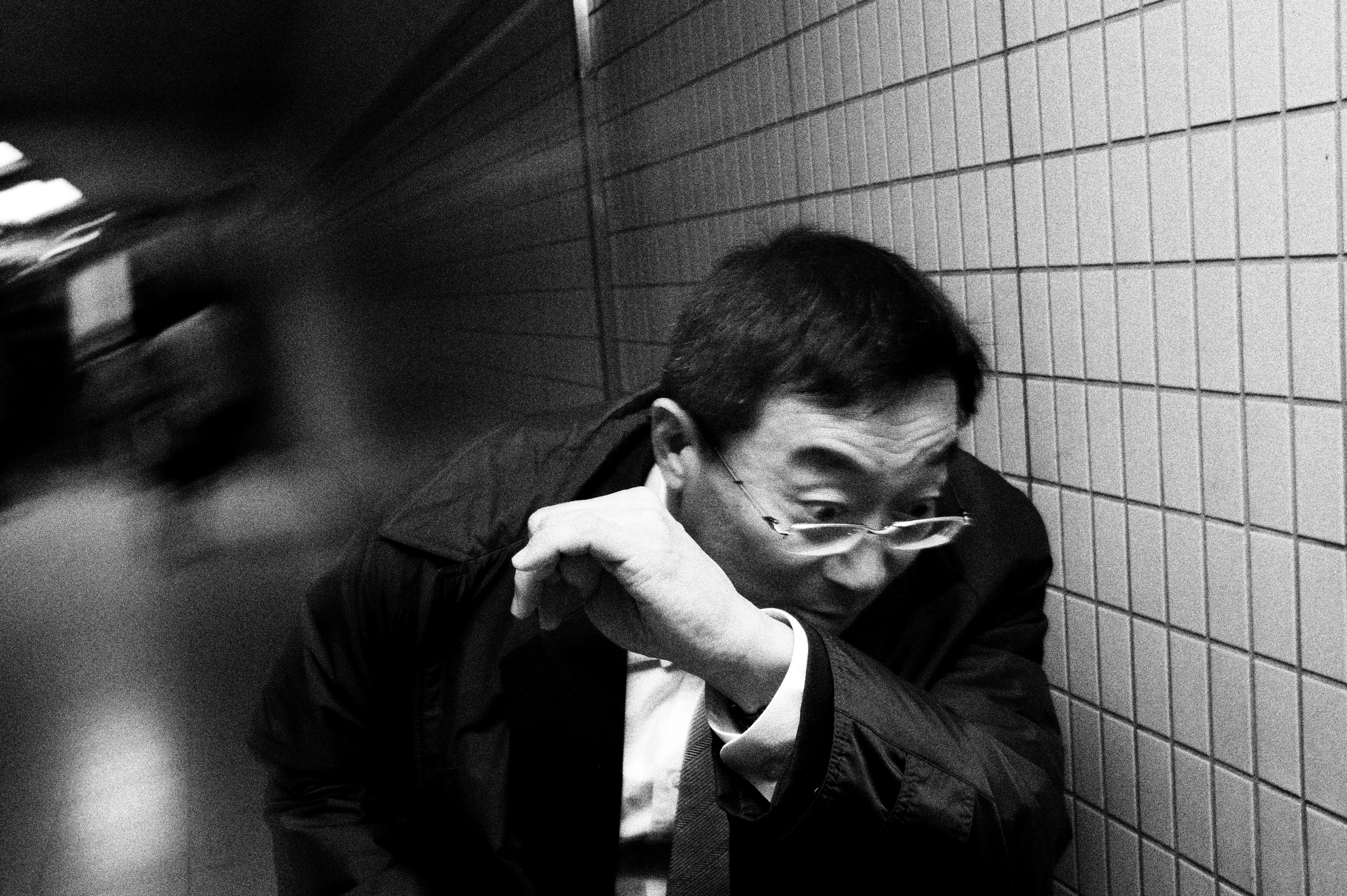 Man dodging. Tokyo, 2011.