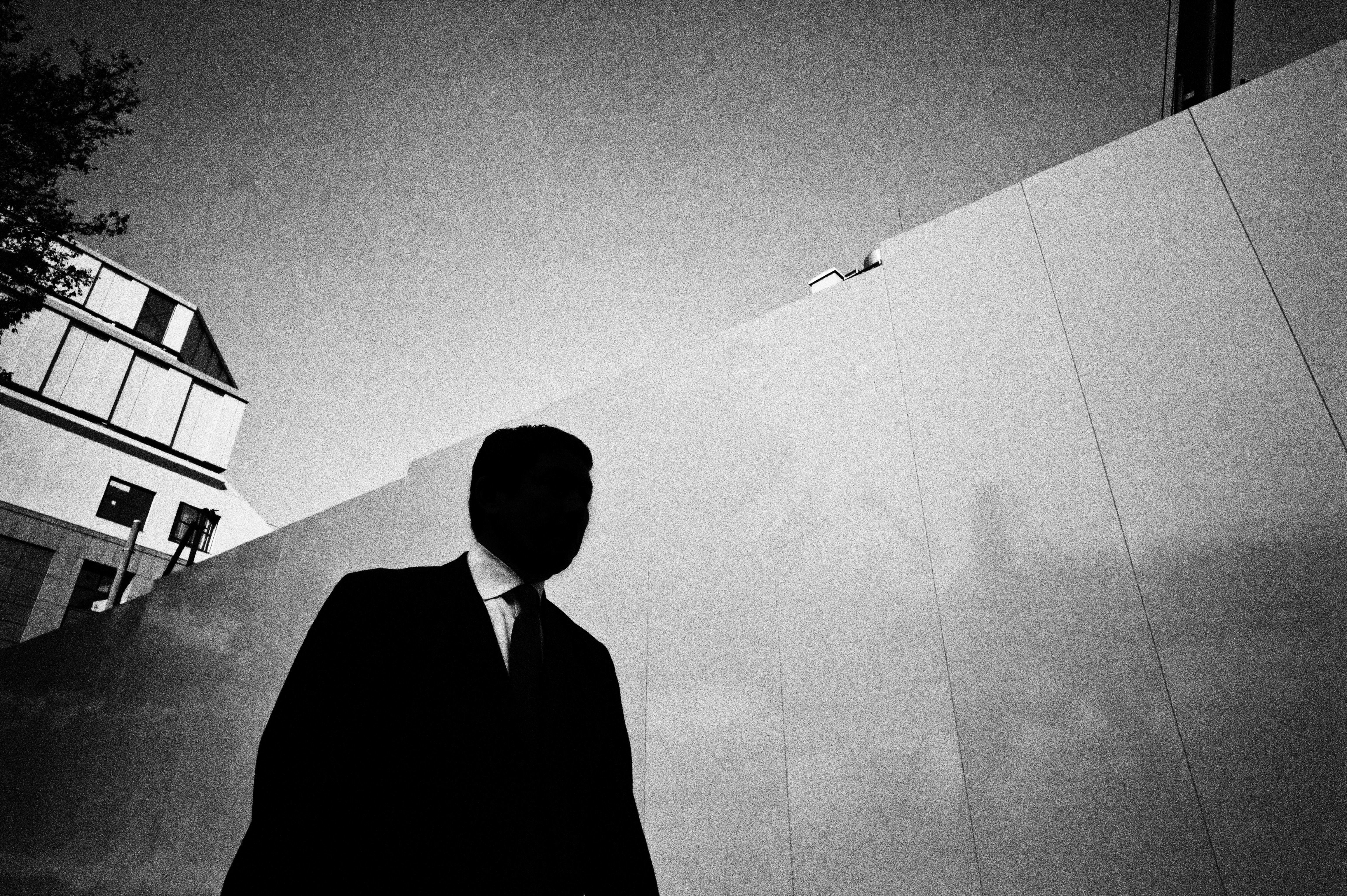 Silhouette suit man. Street photograph in Tokyo, 2011
