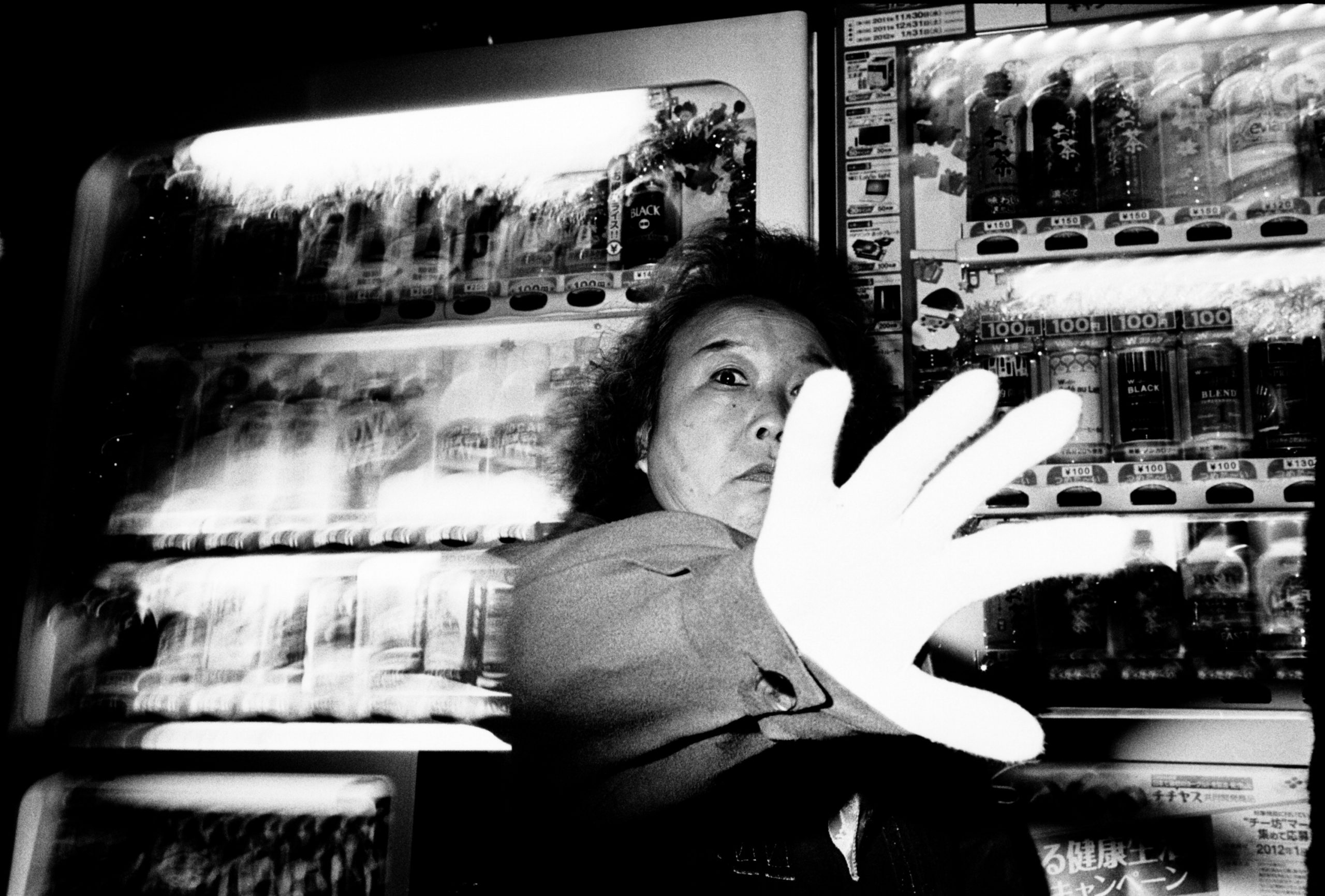 Tokyo woman with hand. 1.2 meters, flash, Kodak Tri-X 400, Leica M6, 35mm
