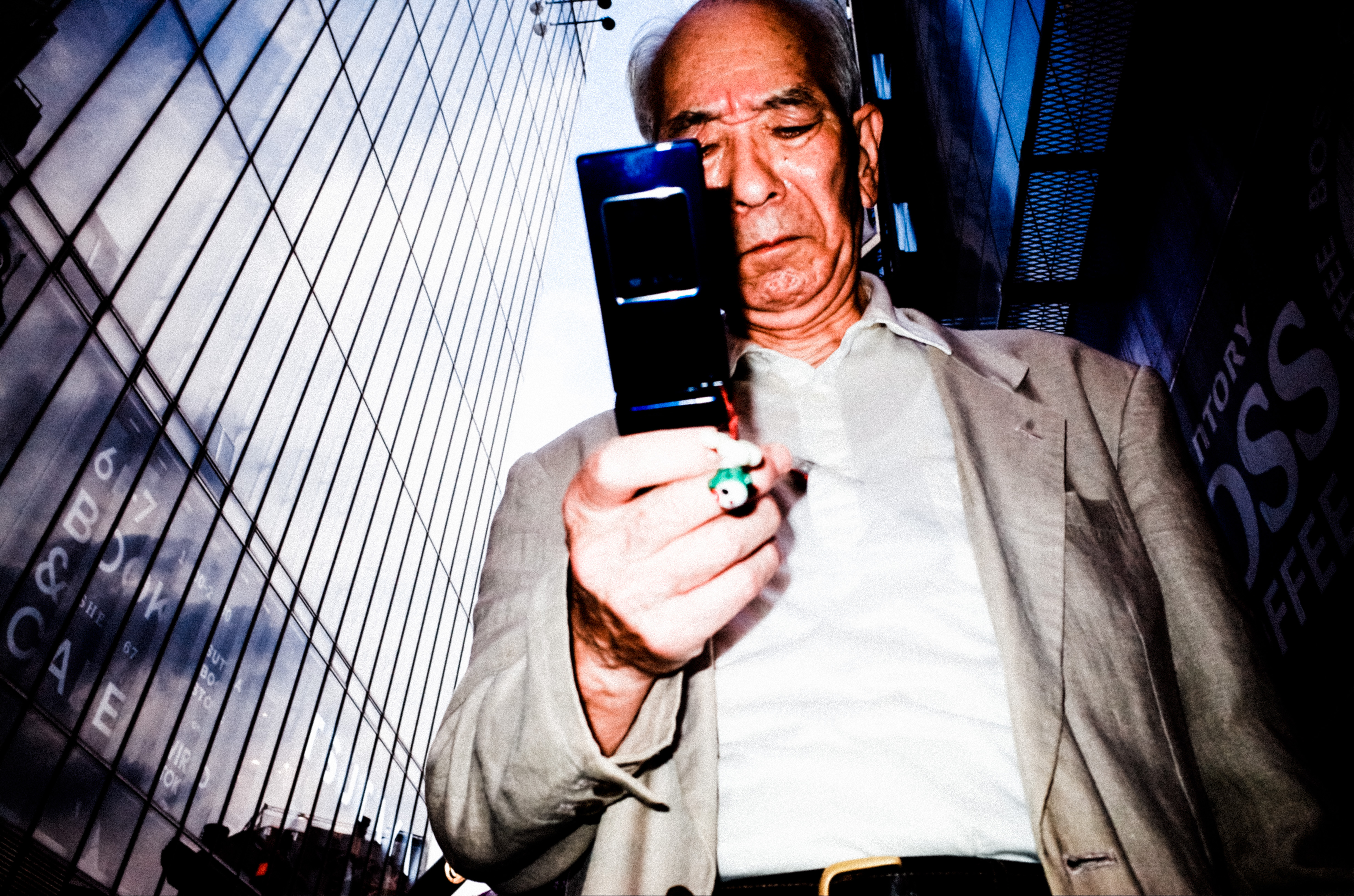 Tokyo man flip phone. Tokyo, 2017. Shot on RICOH GR II with flash, with ERIC KIM Color Preset