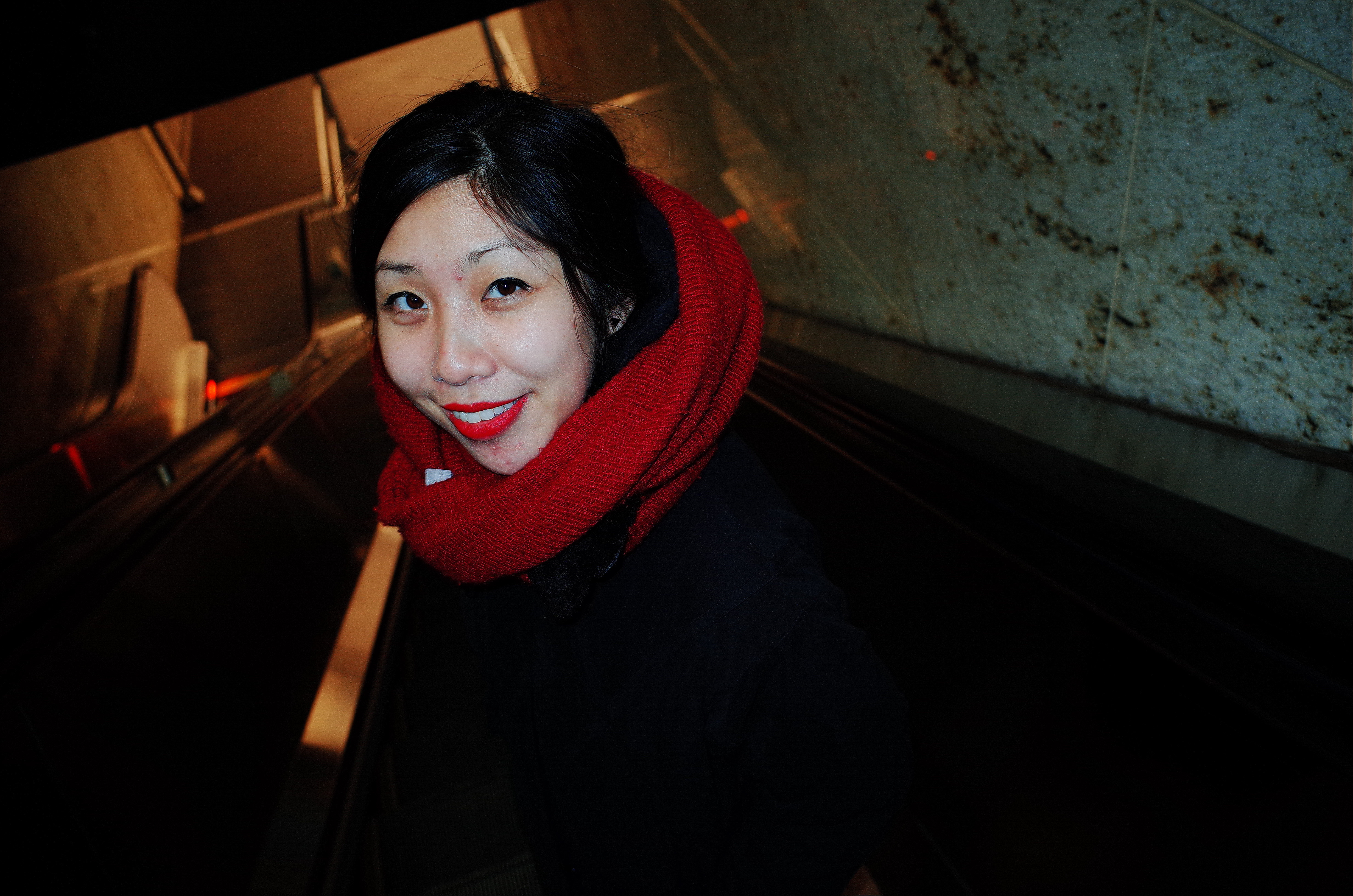 Cindy going down escalator. NYC, 2018