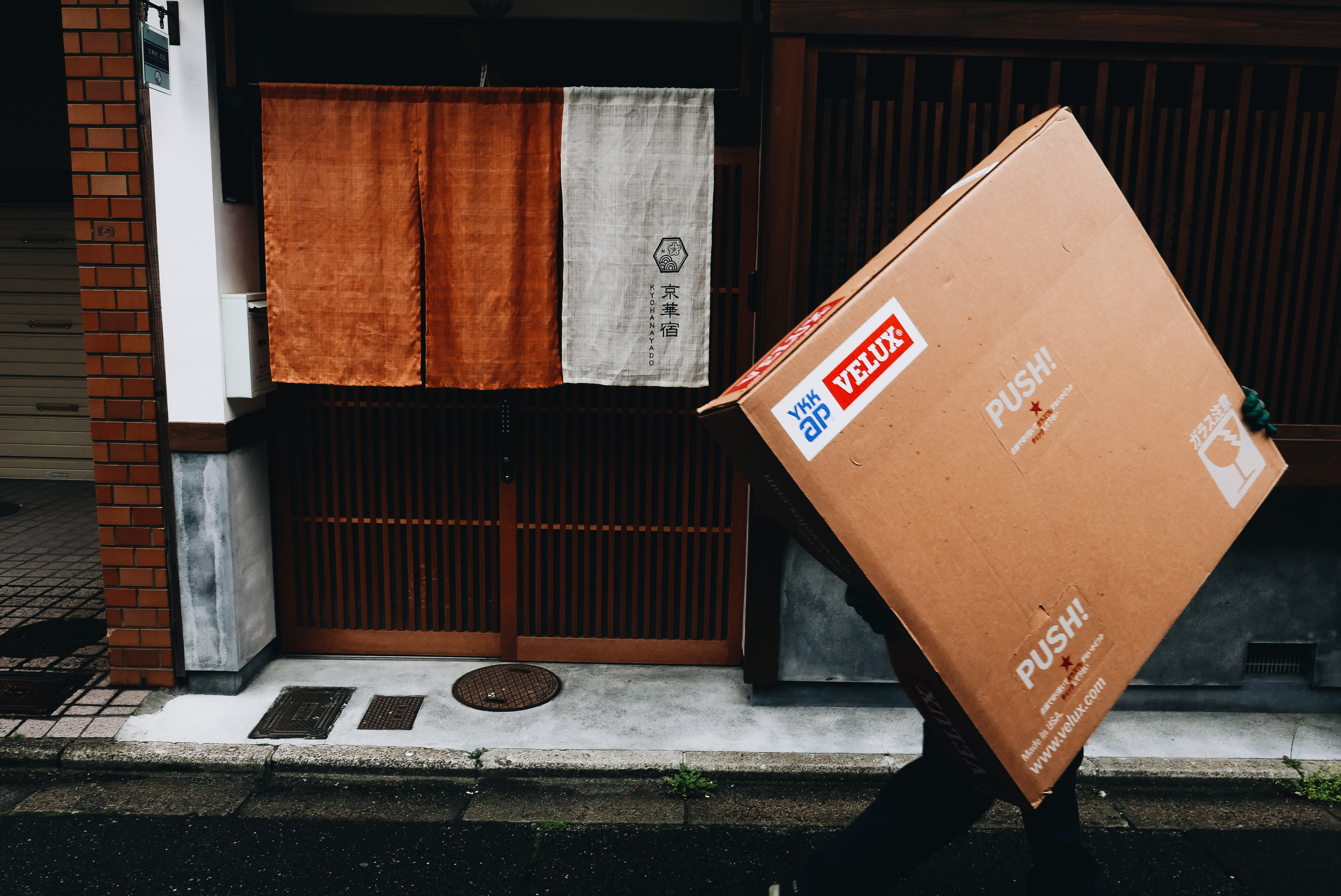 Kyoto man with square box, walking. 2018
