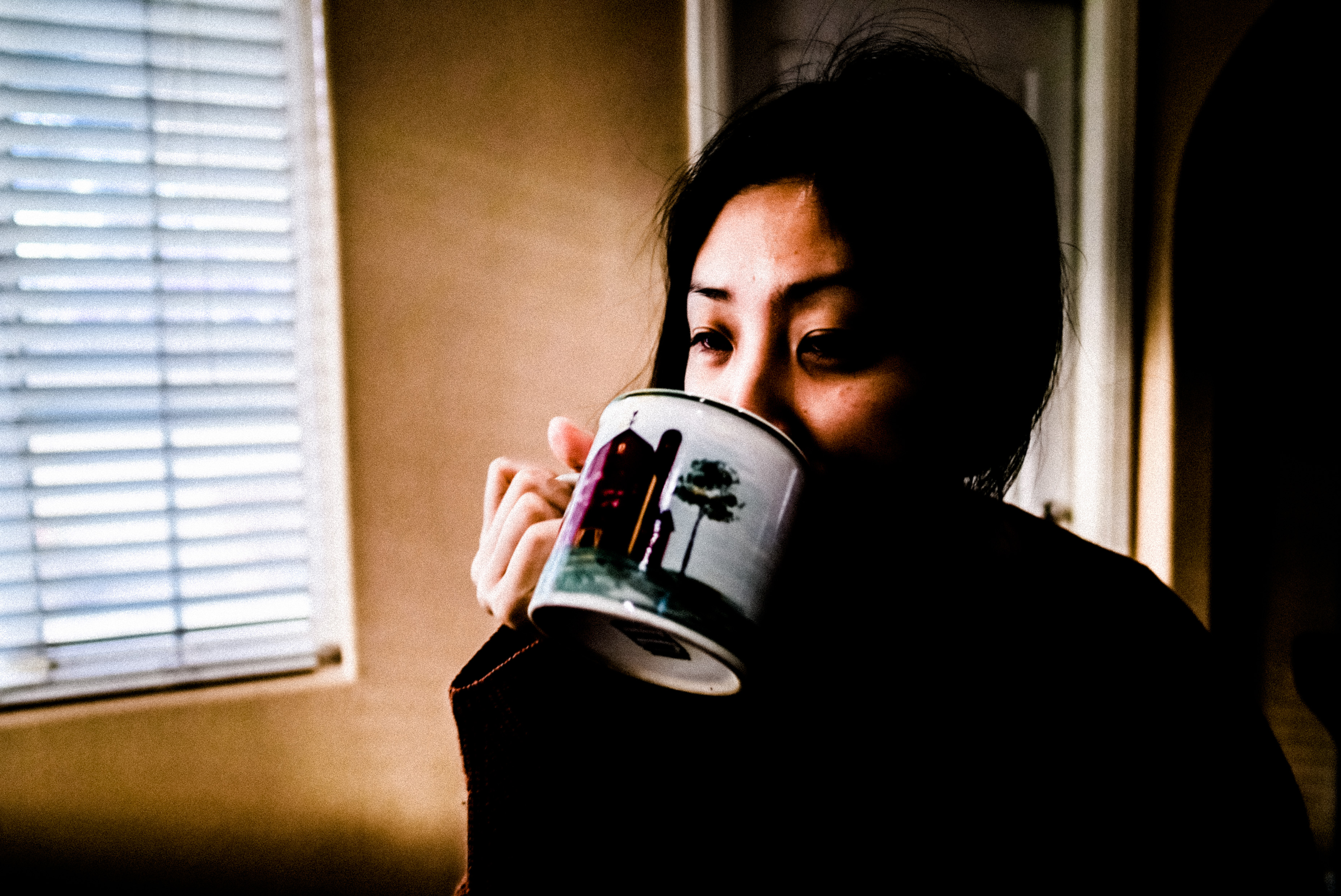 Cindy drinking coffee, living room. LA, 2018