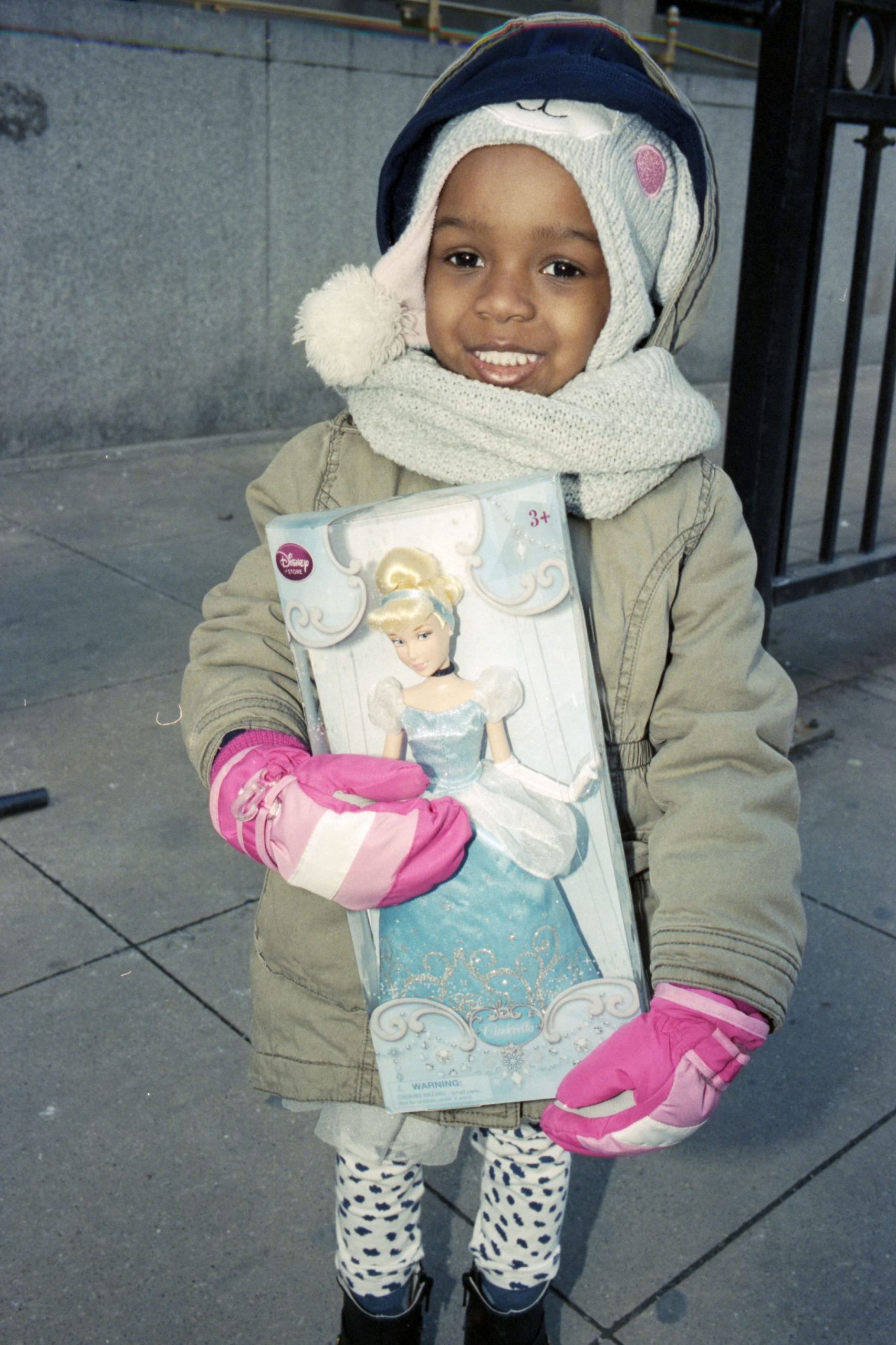 African American girl with caucasian Cinderella doll pink gloves Chicago street photograph ERIC KIM