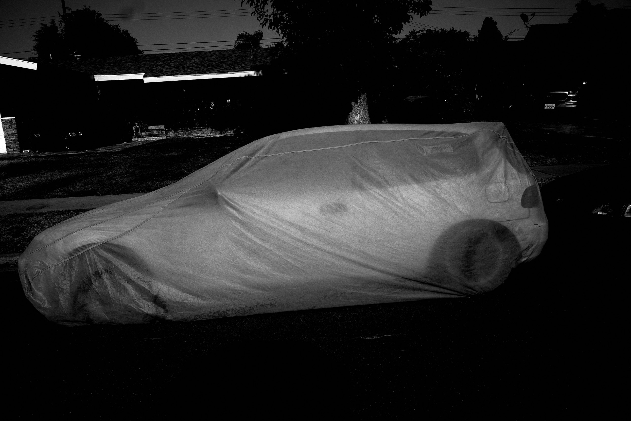 ghost car black and white urban landscape 